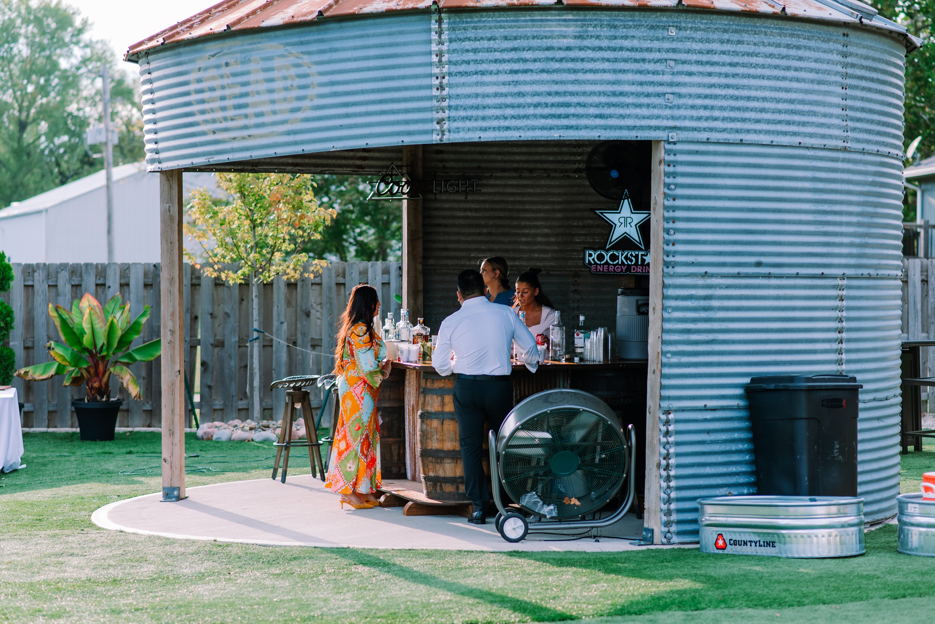 Guests enjoying drinks at the converted grain bin bar